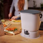Bokashi Organko bin on kitchen counter while preparing food